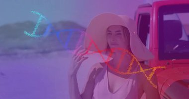 Şapka ayarlayan, sahile bakan, DNA sarmalını tutuşturan kırmızı cipin sağlığını gösteren bir kadın. Macera, doğa, keşif, refah, ilham, açık hava, huzur