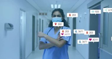 Hastane koridorunda dezenfektan kullanan hemşire sosyal medya ölçümleri yükselip azalıyor. Sağlık, profesyonellik, dijital iletişim, tıbbi ortam, hijyen, güven, teknoloji