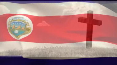 Missouri bayrağını çim tarlasında ahşap haç boyunca dalgalandıran rüzgar onu açığa çıkarıyor ve saklıyor. Vatanseverlik, açık hava, manzara, sembolizm, kumaş, hareket, sükunet