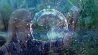 Kadın bahçıvan çocuk odasında havuç kaldırıyor, küresel verilerle küresel verileri birbirine bağlayan küresel üretimi etkinleştiriyor. Bahçecilik, sürdürülebilirlik, teknoloji, yenilik, kentsel tarım, çevre dostu, veri görselleştirme