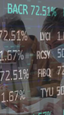 Animation of stock market data processing over diverse colleagues wearing face masks discussing. Global economy and business technology concept