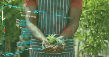 Yüksek çözünürlüklü tohum kullanan tarım uzmanı büyüme verileri için tohum tarıyor ve filizlenme kokusu alıyor. Botanik, yenilik, sürdürülebilirlik, doğa, dijital, çevre, gençleştirme