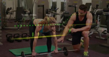 Animation of financial data processing over caucasian man and woman exercising in gym. Global sports, business, finance, computing and data processing concept digitally generated video.