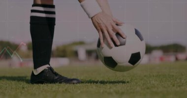 Player shifting weight behind soccer ball on grass driving cleat forward with performance graphs. Athletic, dynamics, motion, outdoor, sport, competition, energy