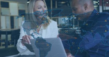 Business duo tapping tablet and consulting, fading world map overlay and reviewing data analytics. Collaboration, technology, data, analytics, teamwork, modern, corporate