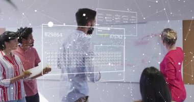 Team manager stepping forward annotating board in business meeting as data overlays refining ideas. Collaboration, innovation, strategy, brainstorming, teamwork, modern, discussion