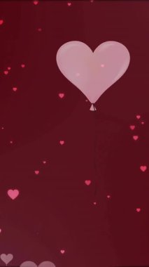 Kırmızı arka planda yüzen ısıların animasyonu. Aşk, romantizm, şenlik, kutlama ve Sevgililer Günü konsepti dijital olarak oluşturulmuş video.