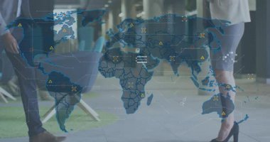 Translucent map appearing in lobby driving tech colleagues shaking hands presenting data via tablet. Corporate, networking, modern, collaboration, digital, innovation, professional