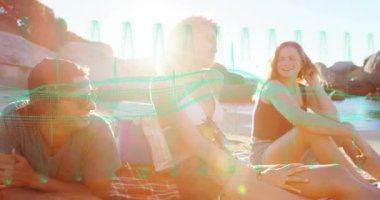 Seyahat arkadaşları gün ışığından sonra battaniyeye sarılıp kayar arkadaş grubuna katılır. Sahil, açık hava, güneş ışığı, yoldaşlık, macera, manzara.