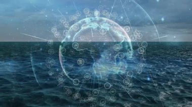 Gün batımında okyanusun üzerinde ortaya çıkan küre, halkalar beliriyor, titreşen düğümler, veri ağı oluşturuyor. Teknoloji, bağlantı, fütürizm, veri, dijital, ağ, yenilik