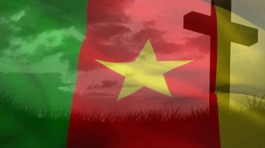 Hafif bir esinti başlıyor. Kamerun bayrağı tepede dalgalanıyor. Çapraz siluetin arkasında gökyüzünü gösteriyor. Vatanseverlik, milliyetçilik, sükunet, sembolizm, doğa, anıt, sükunet