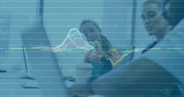 Business team reviewing waveform fluctuation and highlighting chart peak for strategy alignment. Collaboration, teamwork, data analysis, technology, professional, modern, office