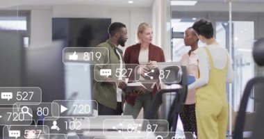 Team reviewing folder and tablet on treadmill desk while campaign metrics overlay appearing varying. Collaboration, innovation, technology, productivity, teamwork, modern, digital