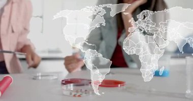 Female students picking pipette, mixing solution in petri dish for lab work with world map overlay. Science, collaboration, research, innovation, education, modern, teamwork
