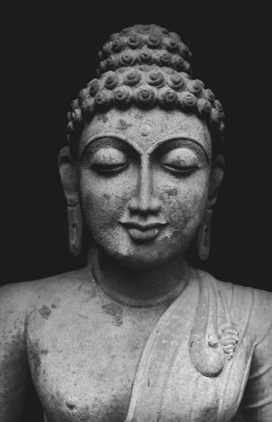 Buddha Statue Isolated On Black Background, Granite Buddha Statue Portrait.
