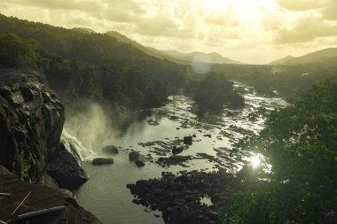 The Top View of Athirapilly Waterfalls with the Smoke. clipart