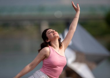 Portrait of a young emotional woman with expressive hands