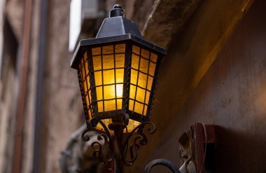 Old wall street lighting, in the old town, Venice, Italy