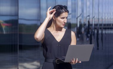 Business woman work on laptop computer at outdoor