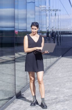 Business woman work on laptop computer at outdoor
