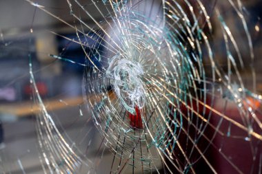 Traces of Vandalism: Shattered Shop Window in a Remote Street, Attempted Robbery, glass package clipart