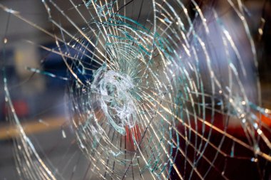 Traces of Vandalism: Shattered Shop Window in a Remote Street, Attempted Robbery, glass package clipart