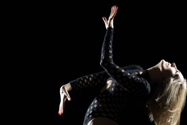 The Ethetics of Dance in the Studio: Blonde Woman in a Black Bodysuit, Expressive Line and Emotions Against a Black Background