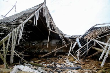 Collapsed old abandoned farm building after a fire clipart