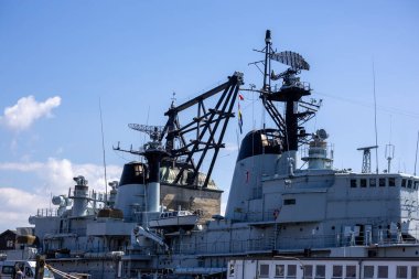 A former warship  now a museum exhibit: the steel giant by the shores of Copenhagen and Denmark's naval heritage in Holmen Harbor. clipart