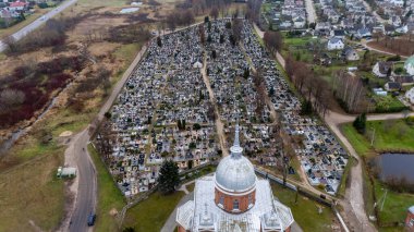 Lithuania. Utena's Church of Christ's Ascension and the Old Cemetery from a Bird's Eye View 11 11 2024 clipart