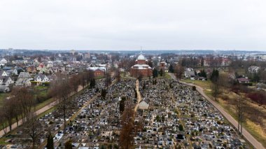 Lithuania. Utena's Church of Christ's Ascension and the Old Cemetery from a Bird's Eye View 11 11 2024 clipart