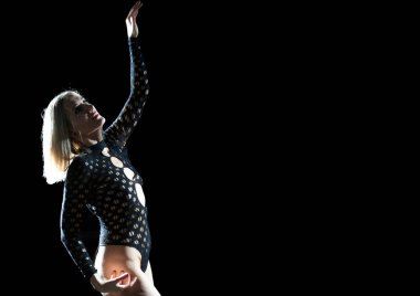 The Ethetics of Dance in the Studio: Blonde Woman in a Black Bodysuit, Expressive Line and Emotions Against a Black Background