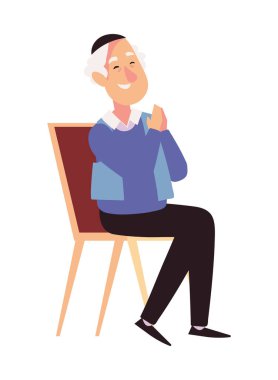 Hanuka ihtiyarı resimde oturuyor.