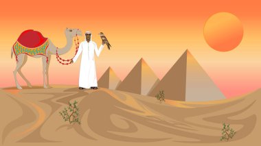 ancient pyramids,Egypt. The hot sun paints the sky in fiery colours. An Arab man leads a camel across the desert.