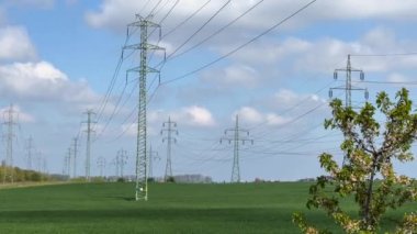 Transmission Towers Against Blue Sky  Powerful Electricity Pylons in 4K, Energy Infrastructure, High Voltage Lines, Power Grid, Electrical Network, Industrial Landscape