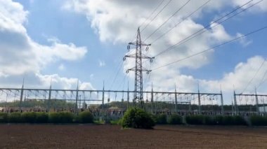 Transmission Towers Against Blue Sky  Powerful Electricity Pylons in 4K, Energy Infrastructure, High Voltage Lines, Power Grid, Electrical Network, Industrial Landscape, Renewable Energy, Engineering