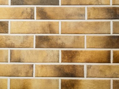 Modern tasarımın tüm kurallarına uygun olarak yapılmış tuğla bir duvar görüntüsüyle rahatlatıcı soyut bir arkaplan.