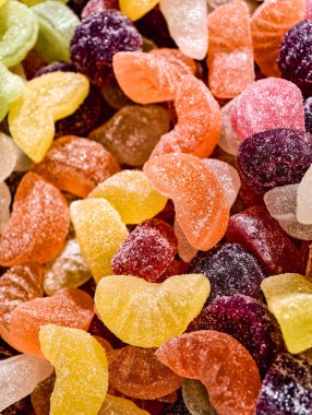 Colorful Fruit Slice Shaped Gummy Candies Sugar Coated Sweet Jelly Macro Photography Delicious Dessert Treat for Kids and Adults Party Snack Food Vibrant Confectionery. Holiday Celebration Background 