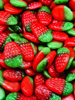 Strawberry Shaped Gummy Candies Red and Green Sweet Jelly Macro Photography Tasty Dessert Treat for Kids and Adults Party Snack Food Vibrant Confectionery Fun Theme Holiday Celebration Fruity 