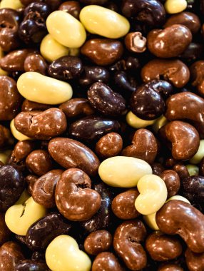 Assorted Chocolate Coated Caramel Cubes Dark, Milk, and White Chocolate Sweet Treat Macro Photography Delicious Dessert Snack for Kids and Adults Party Food Vibrant Confectionery Stock Photo 