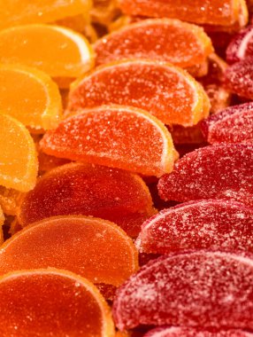 Citrus Slice Shaped Jelly Candies Sugar Coated Sweet Dessert Macro Photography Tasty Treat for Kids and Adults Party Snack Food Vibrant Confectionery Holiday Background. Stock photo 