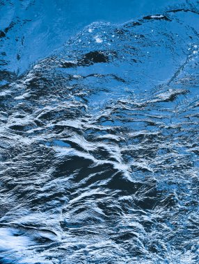 Stunning Deep Blue Water Surface with Intricate Ripples  Eye-Catching Aquatic Textures for Nature Designs and Relaxing Backgrounds
