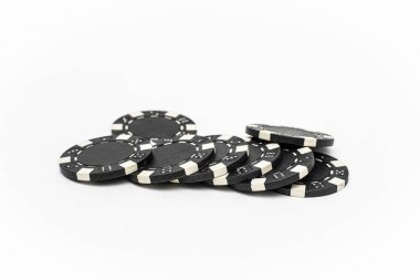 Close-up image of black poker chips arranged in a neat stack on a white background, symbolizing gambling, casino games, and betting concepts. clipart