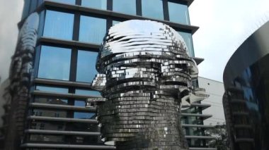 Prague, Czech Republic - September 15, 2022: city view of the Head of Franz Kafka, aka Statue of Kafka, an outdoor sculpture depicting the famous bohemian writer in Prague, Czech Republic. 
