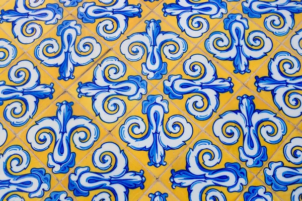Old tiles made of Valencian ceramics, on the facade of the Central Market of Valencia, Spain