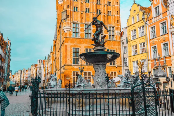 Famous Neptune fountain at sunset. Popular tourist attraction and travel destination in Europe. Architecture city travel Gdansk