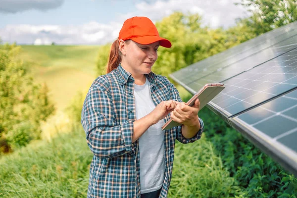 stock image Farmer is using smart tablet to do research about photovoltaic solar panel at garden. Green technology agriculture. Renewable energy, Natural power. Eco-friendly lifestyle. 
