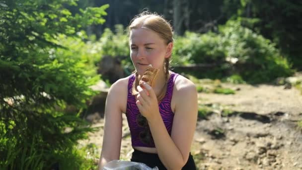 Tired Young Caucasian Woman Sitting Rock Prepared Eat Sandwich Nature — Stock Video