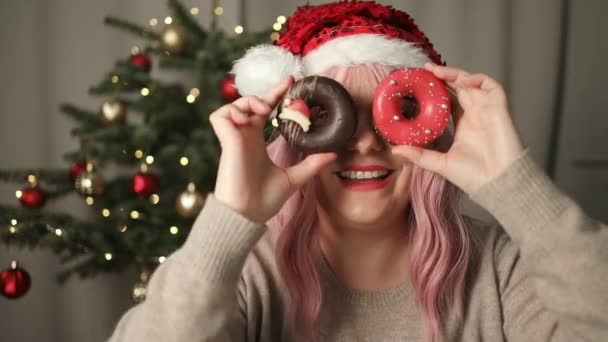 Christmas Celebration Laughing Young Woman Holding Fresh Tasty Chocolate Donuts — Stock Video