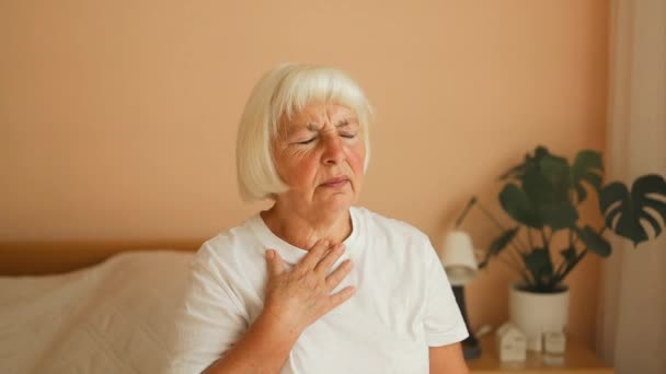 Ill Senior Woman Putting Hand Chest Feels Discomfort Having Pain — Stock Video